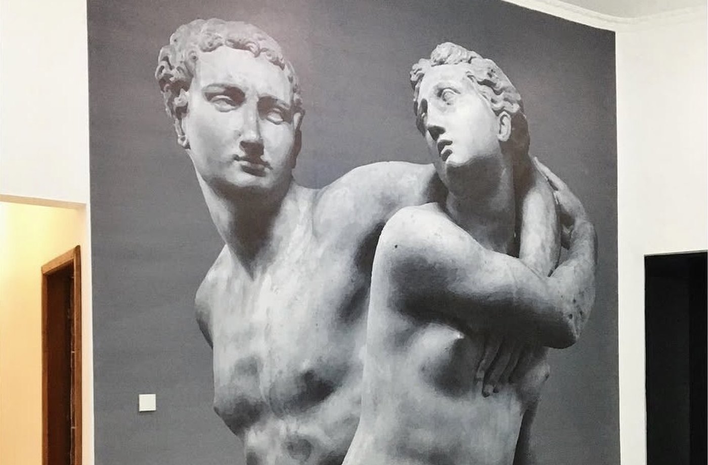 Completed large-format classical statue mural covering a full interior wall